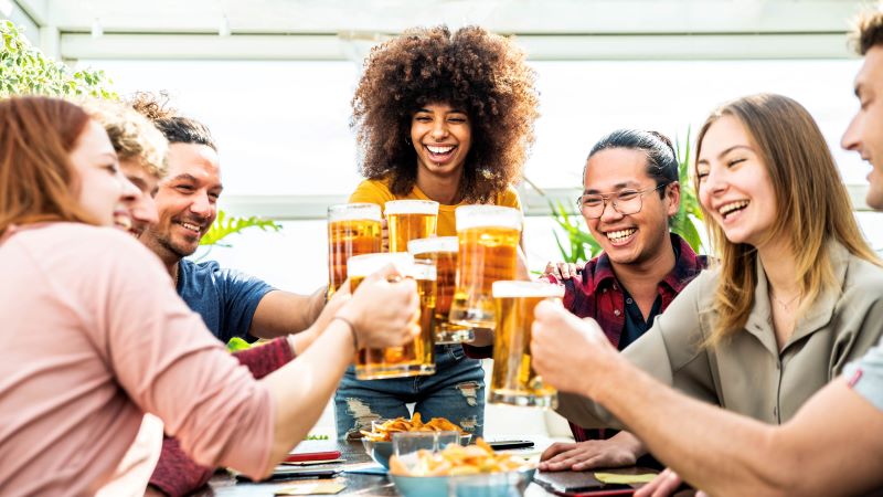 mixed race group of friends toasting beer glasses 2022 03 16 22 13 29 utc