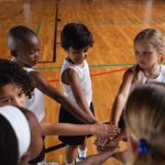school kids forming hand stack