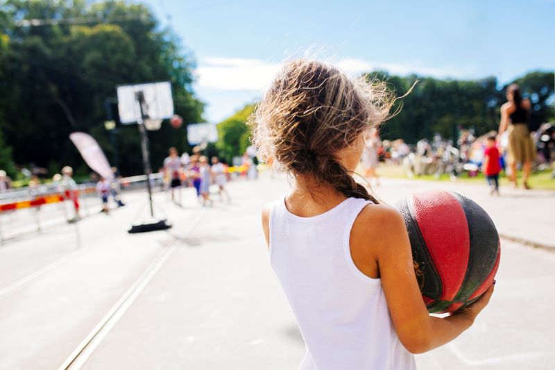 view of girl holding ball