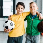 boys posing with balls